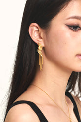 wearing Cupid Tassel Earrings